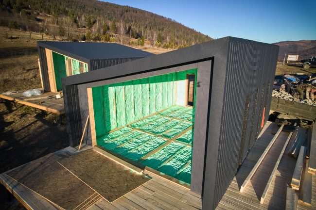 Wooden frame house insulated by polyurethane foam.